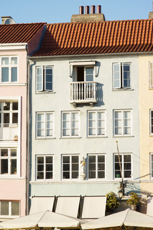 Green historic terraced house in Nyhavn in the center of Copenhagen in Denmarkのeditorial素材