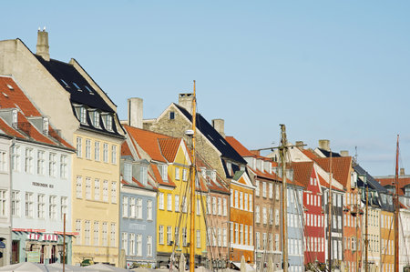Copenhagen, Denmark- April 8, 2023: Panoramic view of Nyhavn in the center of Copenhagen with colorful buildings with a clear blue skyのeditorial素材