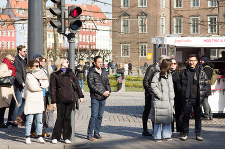 Copenhagen, Denmark - April 9, 2023: People wait at a red traffic light in the center of Copenhagenのeditorial素材