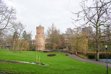 Kronenburgerpark park with Kruittoren tower in winter with trees without leaves in Nijmegen in the Netherlandsのeditorial素材