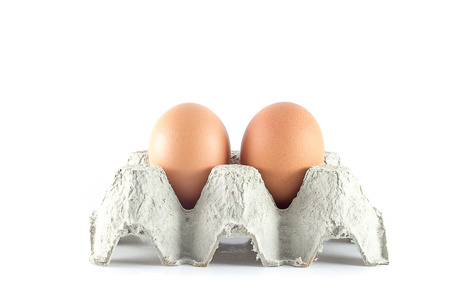 Eggs on Carton with White Background packagingの写真素材
