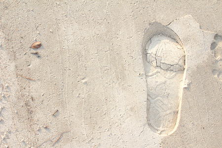 Footprints in the sand background great for vacation advertsの写真素材
