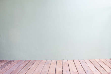 wooden desk and gray wall,の写真素材