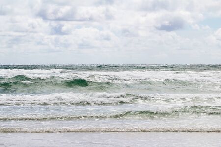 The natural background - white sky dark sunset in a stormy sea.の写真素材