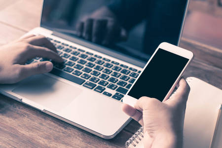 Business ideas, documents on the desk with smartphones and tablets, and social and work networks.