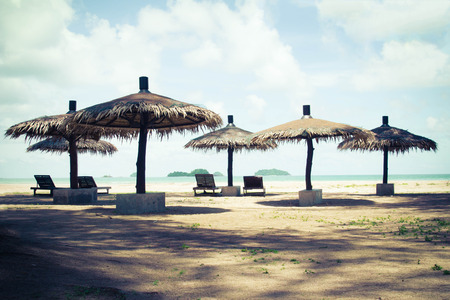 Beach umbrella vintage Popular relaxation area along the beach.の写真素材