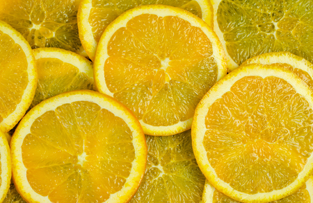 Fresh orange slice pattern on wooden table On plank background