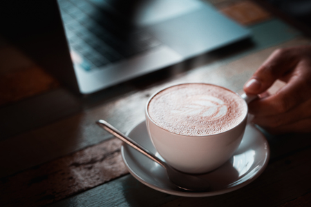 Hot black coffee on a natural background blurred Style dark toneの写真素材
