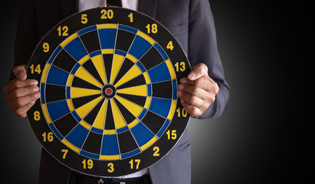 The concept and ultimate goal of the modern day businessman.On a black backgroundの写真素材