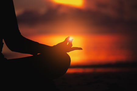 Meditation yoga style silhouetteの写真素材