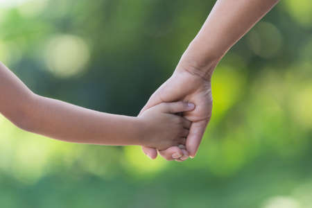 hand hold mom Concept
Love the giver
Of mothers with children On blurred background natureの写真素材