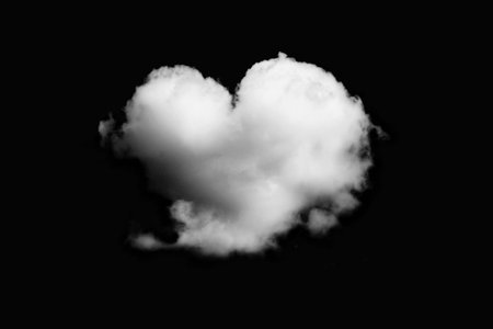 Clouds in the shape of a heart on a black background.の写真素材