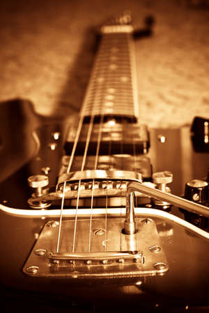 Sepia tone vintage electric guitar