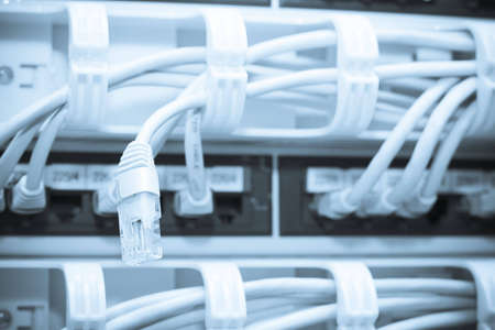 Futuristic blue server. Focus on single ethernet plug