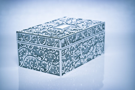 Old cyan metallic retro casket with reflection. Image with vignette effectの写真素材