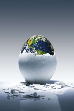 Creative conceptual image.Planet Earth birth from egg.の写真素材