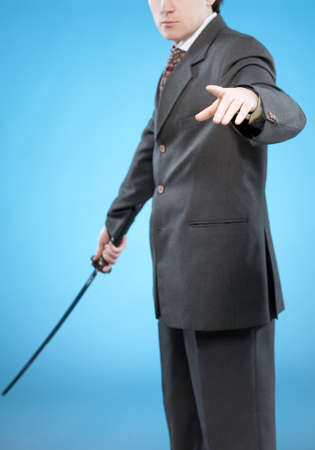 Businessman with sword calling to fight and pointing to you. Conceptual business image.の写真素材