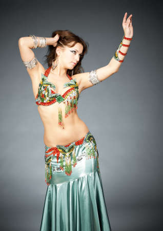 Attractive belly-dancer woman in stylized easter clothing and make upの写真素材