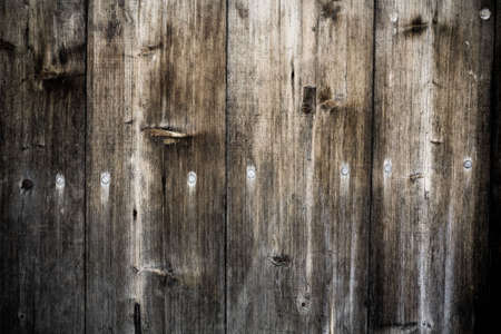 Desaturated grunge weathered torn wooden planks backgroundの写真素材