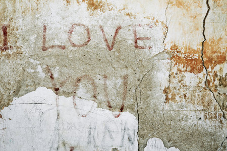 Urban grunge cracked wall background with ''love you'' inscriptionの写真素材