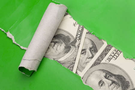 Selective focus image, focus on eyes  Money in  rupture  of green paper close-up の写真素材
