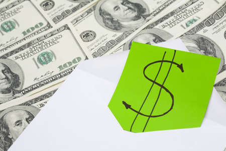 Envelope with dollar symbol inside on money background  Finance concept image の写真素材