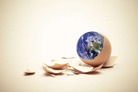 Planet Earth on egg with shell  Conceptual Easter image  Earth in this montage provided by NASA  http   visibleearth nasa gov  の写真素材