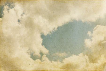 Vintage sky background with dark border and retro textureの写真素材