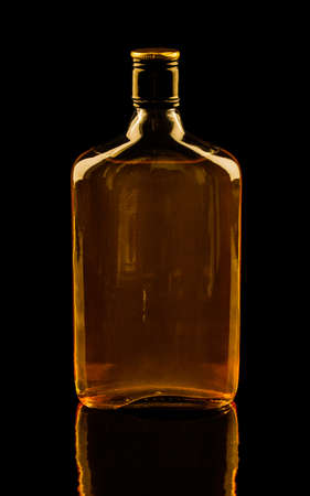 Isolated with clipping paths single bottle of whisky with reflection  Warm colors imageの写真素材