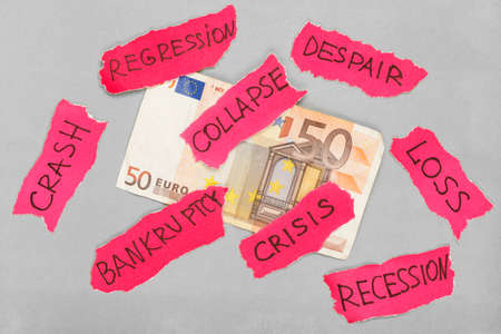 Euro banknote with paper red negative marks. Creative money conceptの写真素材