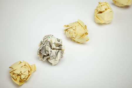 Crumpled dollar bill among office paper. Business concept.の写真素材