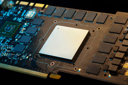 Modern GPU surrounded by memory chips. Low aperture shot, focus on chip