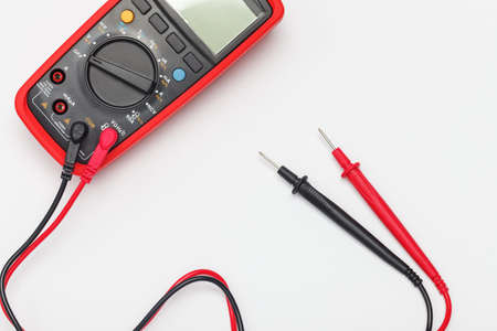 Digital multimeter background with empty space in center. Focus on probes