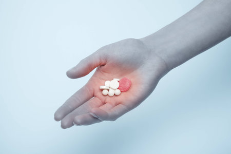 Hand with pills. Health improvement, treatment, helping hand concept