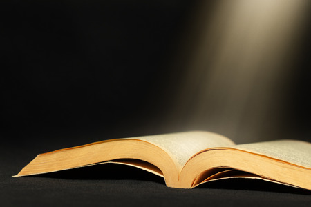 Open book background with light beam and empty space