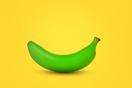 Single green banana with shadow on warm background.の写真素材