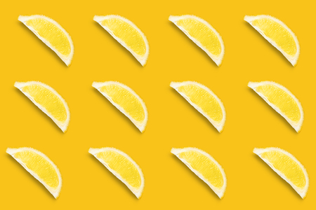 Alined lemon lobules with shadow. Abstract citrus fruit patternの写真素材