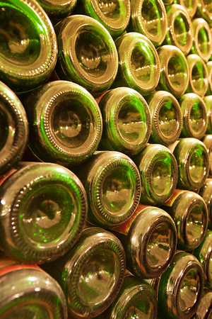 Old dusty wine bottles. Wine production, bottle warehouse backgroundの写真素材
