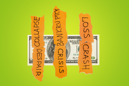 One hundred dollar banknote with falled on it problems and issues. Currency and financial risks conceptの写真素材