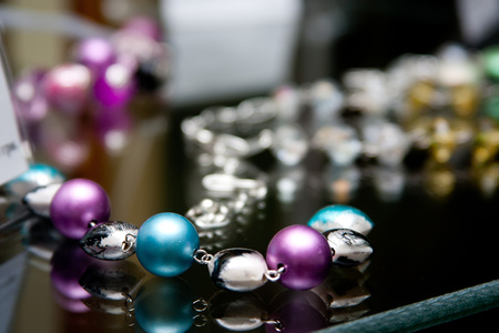 Handmade jewelry and keychains with colorful glass beadsの写真素材