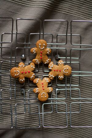 Christmas homemade gingerbread cookies on wooden table