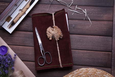Set of travel accessory for woman with cup of tea on wooden vintage backgroundの写真素材