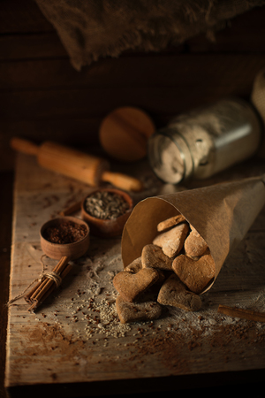 Cooking cookies with cinnamon. Freshly baked cookies in paper bags from the cross.の写真素材
