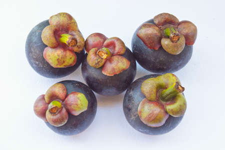 Mangosteen fruit on a white background