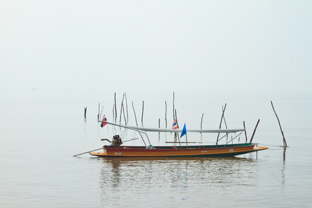 vertical wooden Passenger boat and don hoi lotの写真素材