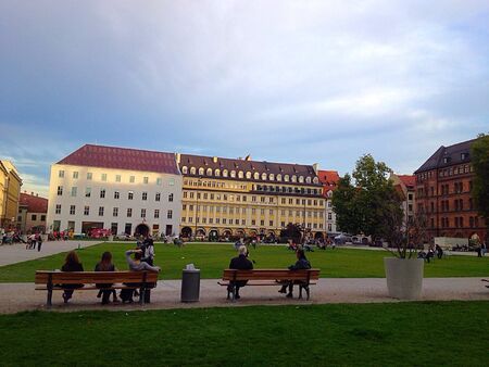Tourists sit at the park relaxの素材