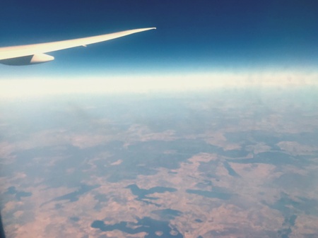 Airplane wings in the sky is hight of 40,000 feetの素材