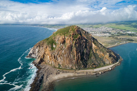 Morro Rock in Morro Bay. Ancient volcanic mound at the end of Morro Rock Beachの写真素材