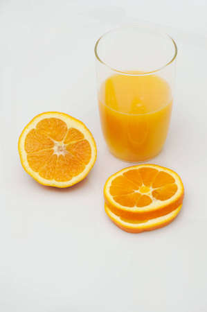 Orange with fresh juice on white backgroundの写真素材