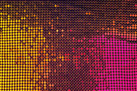 Luxury abstract background with gold and pink sequins  on the fabric. Metallic textured. Place for...